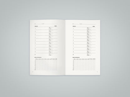 Inside spread of the Bouldering Log Book showing the V-scale grade tracking system