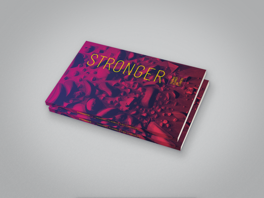 Stack of STRONGER Training Planners showing the matte paperback cover